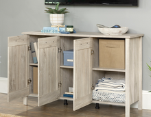 Chalk Oak Sauder three door cabinet